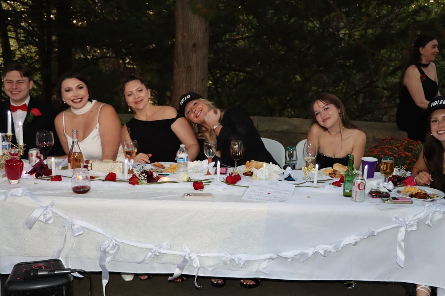 The bride's side of the head table, laughing at dinner
